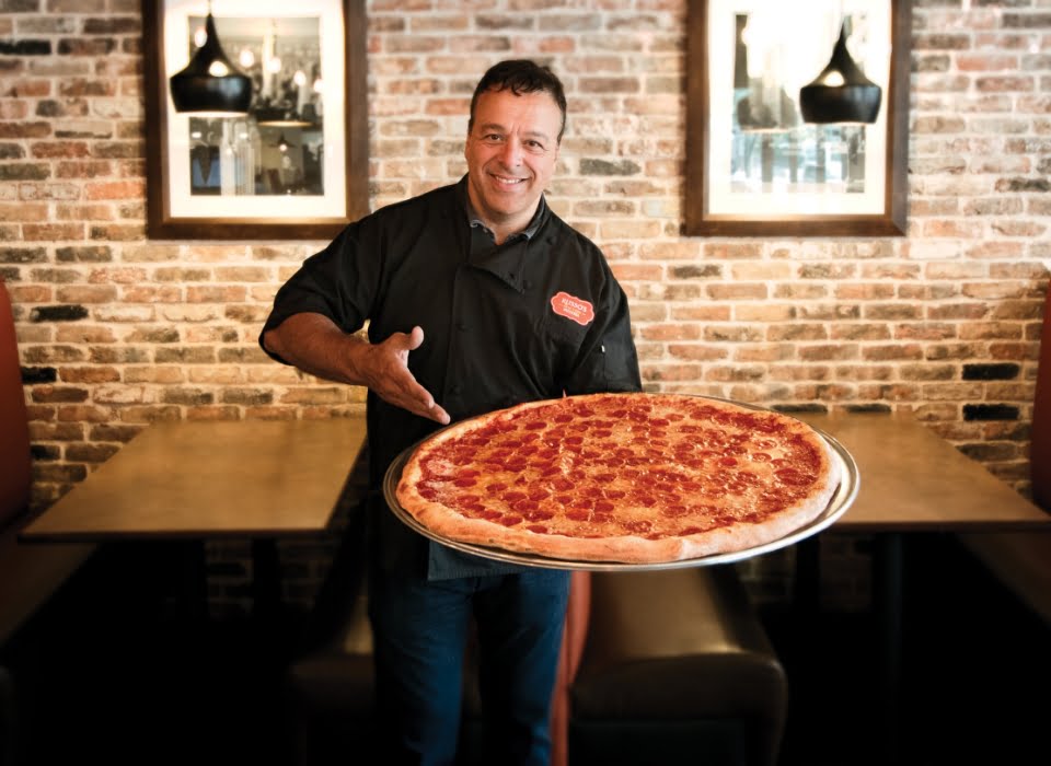 Anthony Russo holding Pepperoni Pizza